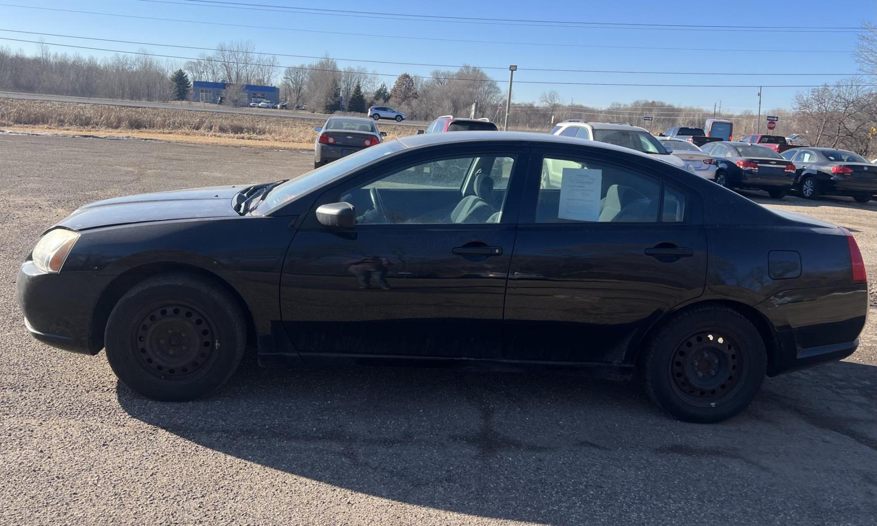 2006 Black Mitsubishi Galant DE (4A3AB26FX6E) with an 2.4L L4 SOHC 16V engine, 4-Speed Automatic Overdrive transmission, located at 17255 hwy 65 NE, Ham Lake, MN, 55304, 0.000000, 0.000000 - Photo#1