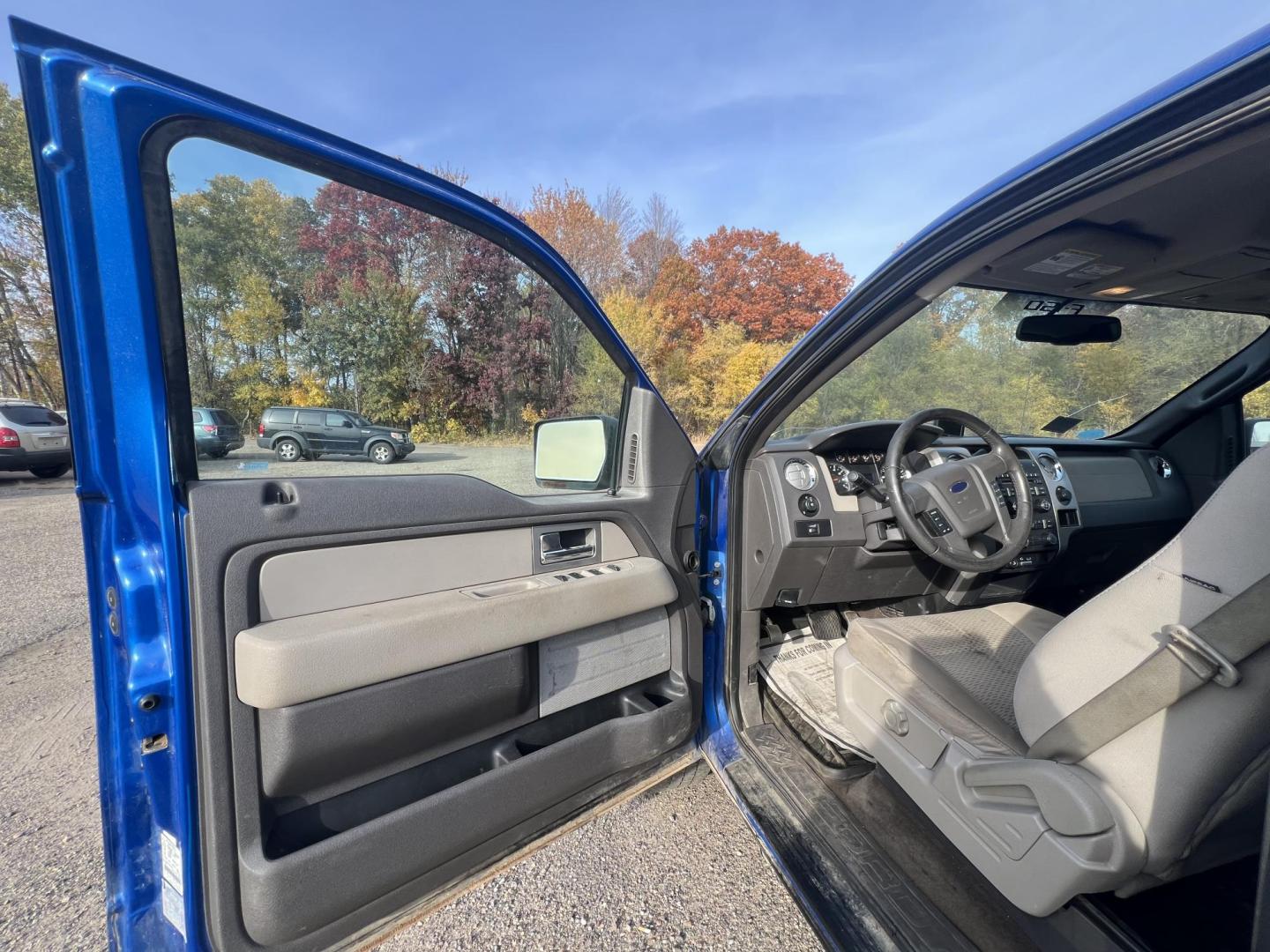 2010 Blue Ford F-150 Lariat SuperCrew 5.5-ft. Bed 4WD (1FTFW1EV1AF) with an 5.4L V8 SOHC 24V FFV engine, 4-Speed Automatic transmission, located at 17255 hwy 65 NE, Ham Lake, MN, 55304, 0.000000, 0.000000 - Photo#9